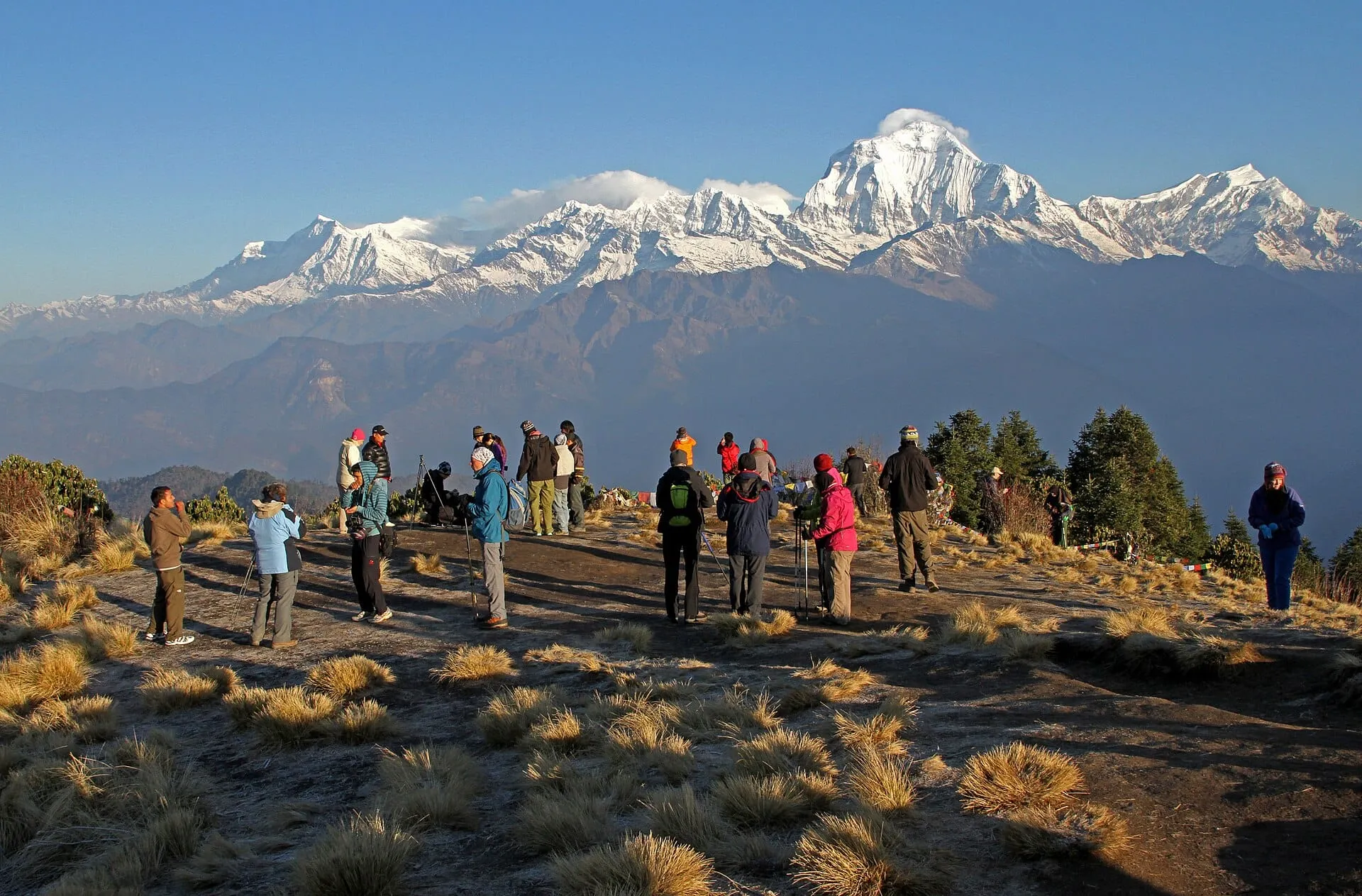 Trekkers watching the sunrise in front of Dhaulagiri on Poon Hill